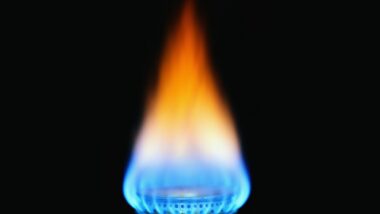 Natural gas aflame with black background.