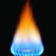 Natural gas aflame with black background.