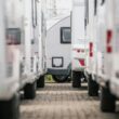 A closeup photo of RV Trailers lined up in a dealership lot.