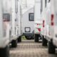 A closeup photo of RV Trailers lined up in a dealership lot.