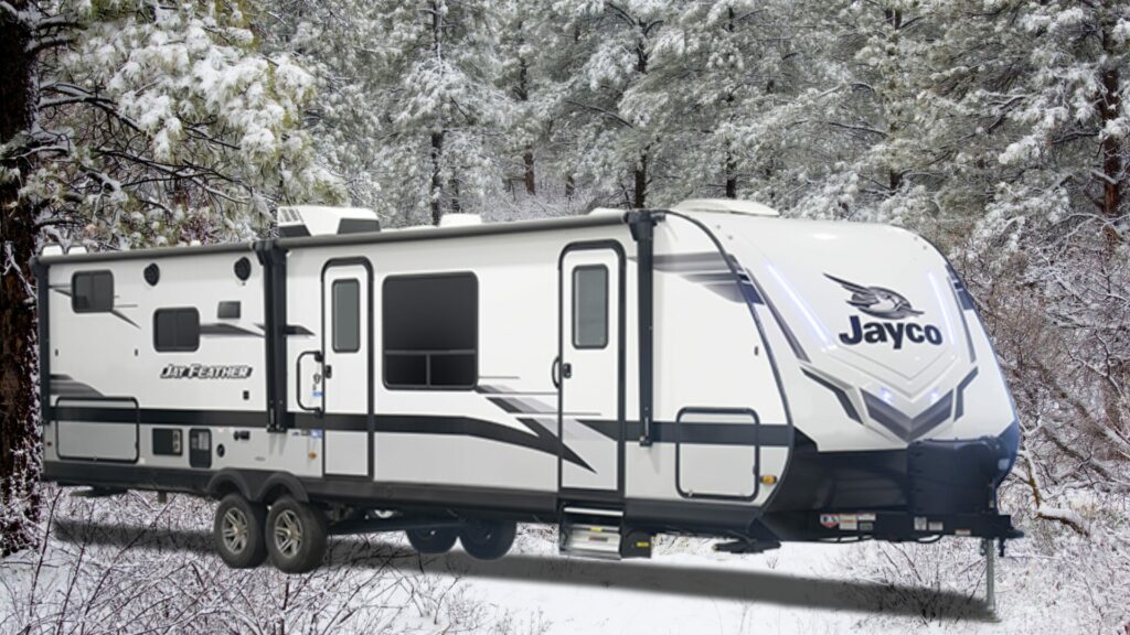 Jayco Jay Feather 30QB exterior with a snowy pine tree background.