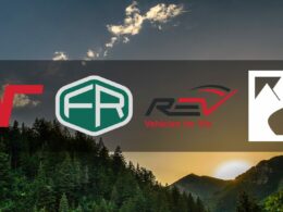 A background image depicting a setting sun over a densely forested ridge as four RV manufacturer logos overlay the image.