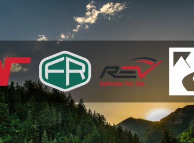 A background image depicting a setting sun over a densely forested ridge as four RV manufacturer logos overlay the image.