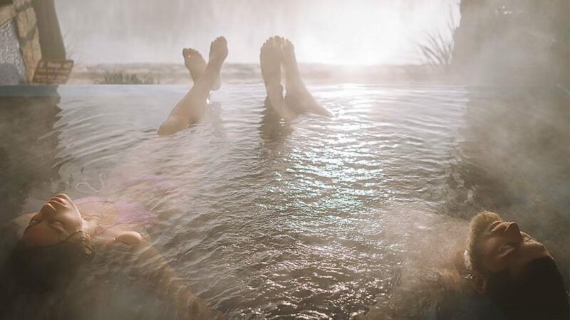 A photo of two people in hot springs in Truth or Consequences, NM.